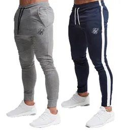 Męskie spodnie sik jedwabna fitness chude spodnie sprężyna elastyczna kulturystyka trening spodni track