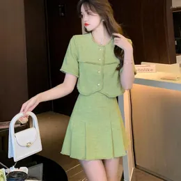 Arbetsklänningar xiaoxiangfeng ålder reducerar cardigan halvskirt tvåstycken uppsättning för kvinnor 2024 sommar casual mode temperament pantdress
