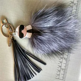 2020 Luxury Logo Fluffy Karl äkta Raccoon Fur Pompom Monster Bag Bugs Charm Keychain Plush Key Ring Leather Tassel Pompom244484174J