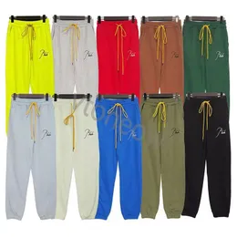 Pantaloni da uomo autunno Rhude Pantaloni da jogging Pantaloni da donna di lusso in cotone dio lungo Pantaloni da jogging riflettenti Pantaloni casual Botton Pantaloni sportivi 2023