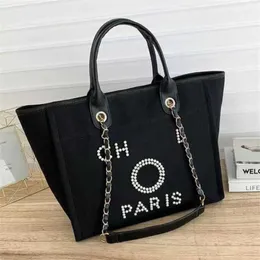 Saco de praia de lona de mão feminina de luxo bolsas clássicas mochilas grandes com capacidade para pequenos pacotes de corrente grande crossbody C7LQ loja de fábrica venda nos eua