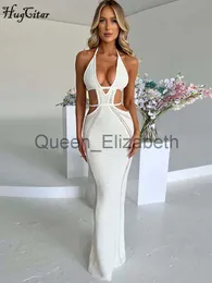 Abiti casual Hugcitar Crochet Halter senza maniche Backless Solid Hollow Out Bandage Sexy Slim Maxi Prom Dress 2022 Winter Festival Party Outfit J230625