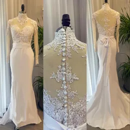 2023 Abiti da sposa a sirena Collo alto africano Appliques in pizzo Fascia in raso Maniche lunghe Sweep Train Vestidos De Novia Abiti da sposa Immagine reale Bottone Indietro