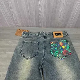 Mäns jeans designer vårhöst jeans byxor regnbåge graffiti denim byxor män sträcka smala raka slacks trendiga beskuren egenj