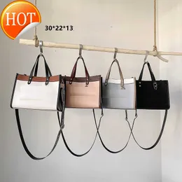 2023 Kvinnors varumärkesdesignväskor handväska axel crossbody väska tote ny mode textur läder stor kapacitet multifunktionell bärbar totebags fabriksförsäljning