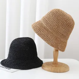 Japansk trendig virkning hink hatt för kvinnors strand solskydd halm hatt kvinnor designer casual mode panama