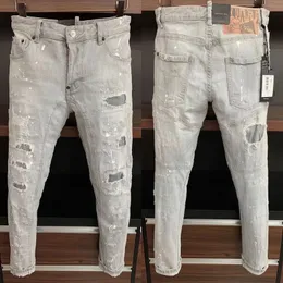 Jeans masculino slim fit cinza com detalhe de respingos de tinta danificado