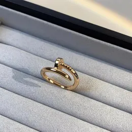 Anel de designer Amado chaveiro Anel de prego anel de ouro Midi Liga de aço de titânio Banhado a ouro 925 prata esterlina designer de joias anel de promessa anel masculino Anel de amor