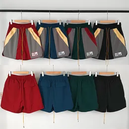 2023 Designer Mens Shorts High Street Rhude Short Hafdery Dopasowanie kolorów Elasts Mężczyźni Kobiety Sport Spodobal unisex Split Kolorowe spodnie Piąte spodnie Europejskie S-XL