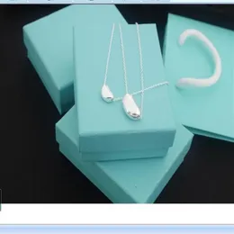 2020 cheap stainless steel thin chian with two little bean plate Pendant Necklaces with blue box and dastbag271r