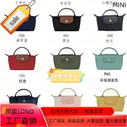 Französische Longxiang-Brötchen-Mini-Knödel-Umhängetasche ohne Stanzen, einfache und modische tragbare Make-up-Handtasche