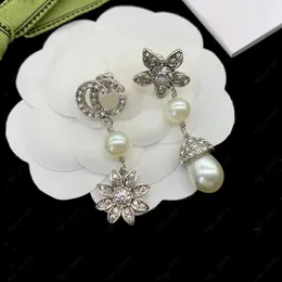 Stijlvolle zilveren hangende kroonluchter oorbellen met diamanten letters witte hars hanger designer oorbellen damesfeest geschenksieraden