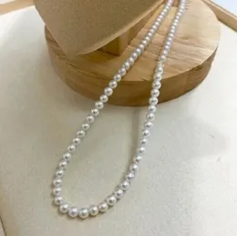 Charms Charm AAA56 mm natürliche weiße Perlenkette aus dem Südchinesischen Meer mit 14-karätiger Goldschnalle 231010