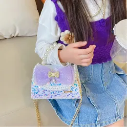 Handväskor koreanska stil barn mini handväska söta bowknot crossbody väskor för baby flickor myntpåse småbarn pärlor handväskor 231010