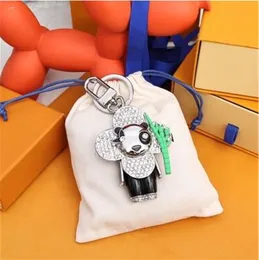 Fashion Keychain Luxury Designer Stylish Sun-Flower Doll Pendant Keychains Buckle Mens Womens Väskor Keys Ring Ornament High Quality Gift With Box och Dustbag J54