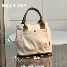 Bolsas 90% de desconto na nova versão pequena bolsa de lona portátil de nicho fresco lancheira bolsa de lanche bento bolsa feminina bolsa de mamãe bolsa feminina