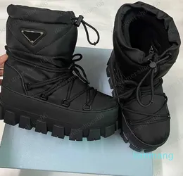 Boots Nylon gabardine apres ski boots Black 1U007N Upper with drstring Removable padded pile lining Enameled metal triangle booties rubber sole designer