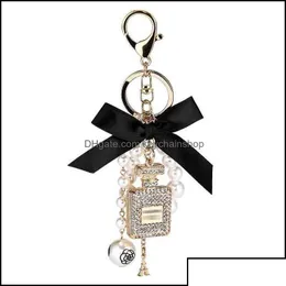 Keychains Lanyards Keychains Fashion Accessories Creative Handmade Diy Diamond Per Bottle Alloy Bow Pearl Luxury Keychain Purses Cha Dh7Ze