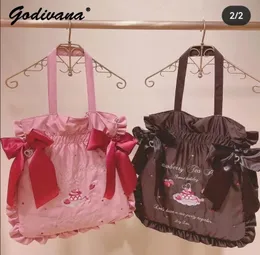 Kopplingar japanska Lolita Liz Strawberry Party Handbag Girls Stora kapacitet Tecknad bokstäver Bowknot axelväska damer mode tote 231018