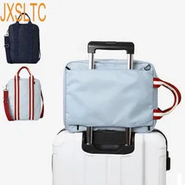 Duffel Bags JXSLTC Nylon WaterProof Duffel Bag Men Travel Bags Foldable Suitcase Big Capacity Weekend Traveling Bag Female Packing Cubes 231019