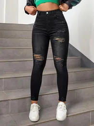 Calça jeans skinny feminina preta rasgada