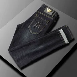 Blå mörka jeans herrmodemärke smalt passar liten rak elastisk höst och vinter tjock