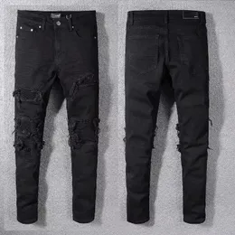 2022 jeans da uomo jeans jean hip hop pantaloni stradali tendenza decorazione a catena con cerniera strappata in forma slim fit motociclette pannelli pannelli pannelli Natale