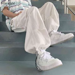 Мужские брюки весенняя шнурки большие карманы грузовые брюки мужчины прямые мешковатые на высоких улицах.