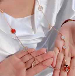 V gold material Luxury 15pcs flower shape charm long chain pendant necklace in rose color plated have nature shell beads and red agate have box stamp PS7257A