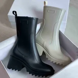 نساء Betty Boots PVC Rubber Beeled Platform الركبة عالية الطول حذاء المطر الأسود مقاوم للماء أحذية في الهواء الطلق في الهواء الطلق الكعب العالي العالي