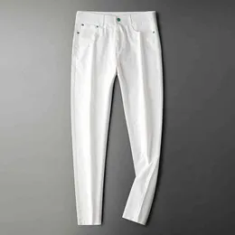 Calça masculina de bolso traseiro tecido de luxo internacional Jeans branco sofisticado Tubo reto masculino Calça de lazer em e de alta qualidade