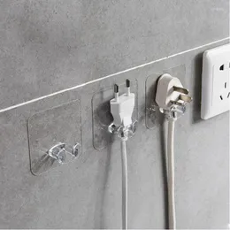 Krokar 1pc väggförvaringskrok Power Plug Socket Holder Adhesive Hanger Home Office nagelfri tråd transparent klibbig