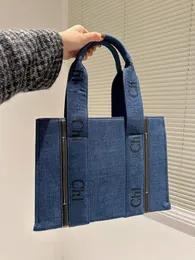 Kvalitetskvinnor Totes reser axelhandväskor Woody Tote shoppingväska handväska topp nylon hobo mode denim stora strandväskor lyx designer crossbody väskor pursar flicka