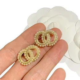 Orecchini in oro da donna alla moda, orecchini a bottone