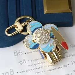Modedesigners nyckelringar klassiska bokstäver gyllene solblommor lanyards lyx kvinnors väskor män bilar älskare nyckelringar kedjor nyckelringar