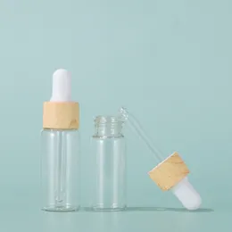 5ml 10ml 15ml 20ml 20ml Taşınabilir berrak esansiyel yağ şişeleri Cam boş damlalı şişe plastik ahşap taneli kapak