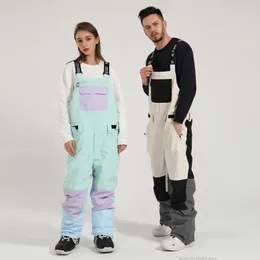 Skiing Pants Winter Nieuwe Ski Broek Vrouwen Bretels Snowboard Waterdicht Winddicht Ademend Kleuraanpassing Een Stuk Sneeuw Mannen