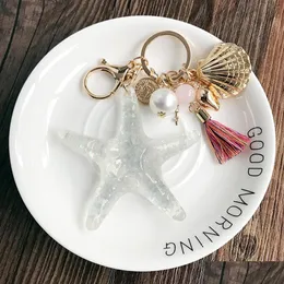 Nyckelringar Lanyards Starfish Keychain Par Key Ring Shell Crafts Pearl Chains Lady Bag Pendant Necklace Light BB Ribbon Car Trend DHBV3