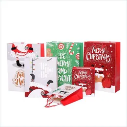 Decorazioni natalizie Sacchetto regalo di Natale in carta Cartone animato Stampato Merry Shop Gioielli Cosmetici con manico S M L Drop Delivery H Dhydd