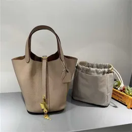 Bolsa de design novo botão de ouro cesta de vegetais Togo Togo camada superior Caminhão de cheiro de cheiro cozido de pacote de pelúcia fêmea portátil feminina portátil