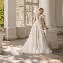 Bröllopsklänning Ueteey Sparkly spets tyllklänningar ser igenom djup V-ringning Kort ärm båge öppna ryggklänningar 2022 Vestido feminino