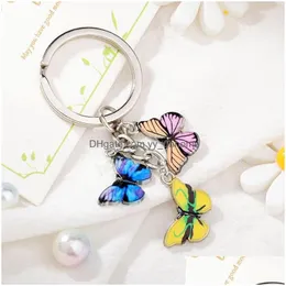 Nyckelringar Colorf Butterfly Keychain Color Drip Insekter bil Key Ring Women Bag Tillbeh￶r Jycken g￥vor Drop Leverans DHGZS