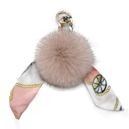 Keychains 9cm Big Natural Fox Fur Pom poms Key chain Keychains For Women Scarf Print Silk Bowknot Ribbon Metal Bag Charm Key Holder f274 T221006