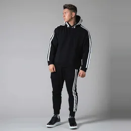 رجال مسارات Man Hoodie مجموعة الحدود الخريف والشتاء سروال سترة جديدة مرنة مرنة النحافة الجري في الهواء الطلق دعوى twopiece g221011