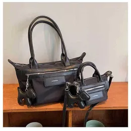 Väskor 2022 Autumn and Winter New Black Knight Dumpling Bag Female Summer Cool SA Minority Portable Sling Single Shoulder Cross Car Pures