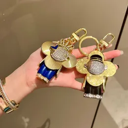 Tinoaly Portachiavi Girasole Per AirTag – Ciondolo Pelle A Forma Di Girasole, Clip Portachiavi Per Borse E Zaini, Giallo E Arancione - copertina