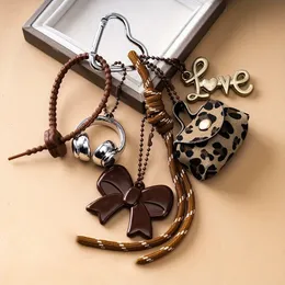 Set Di 2 Portachiavi Con Ciondolo A Fiocco E Strass - Oro E Argento, Glamour Per Borsa E Zaino
