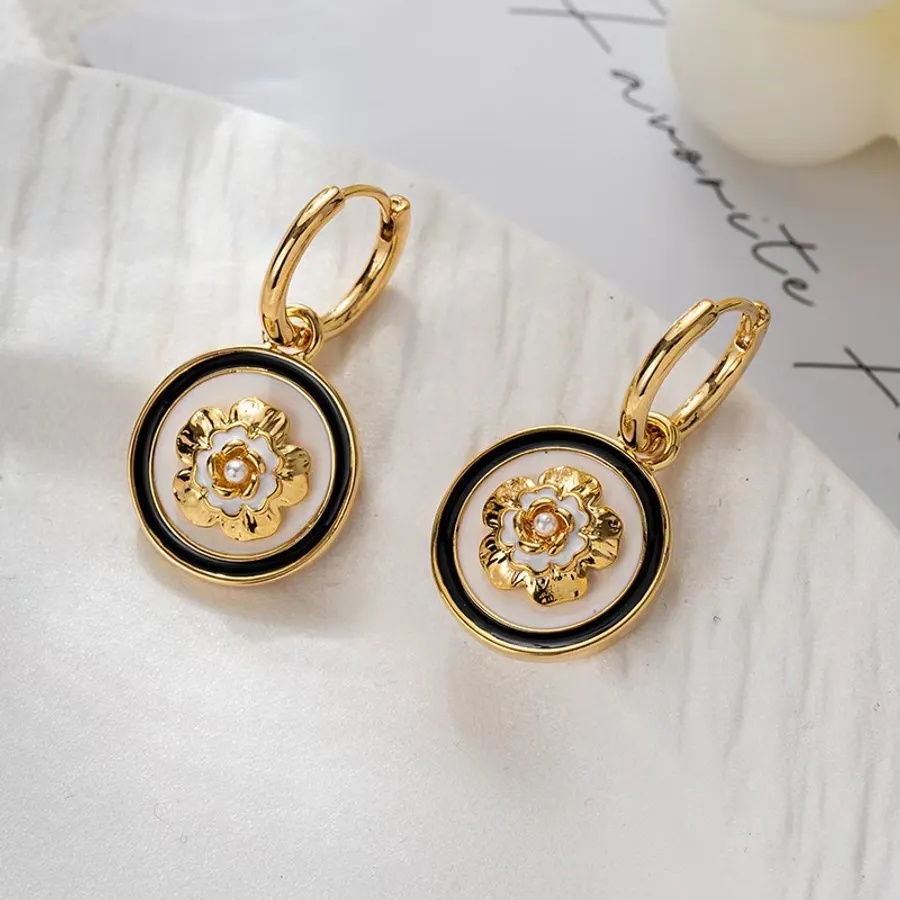 Camellia charm earrings or simple hoops: which earrings are