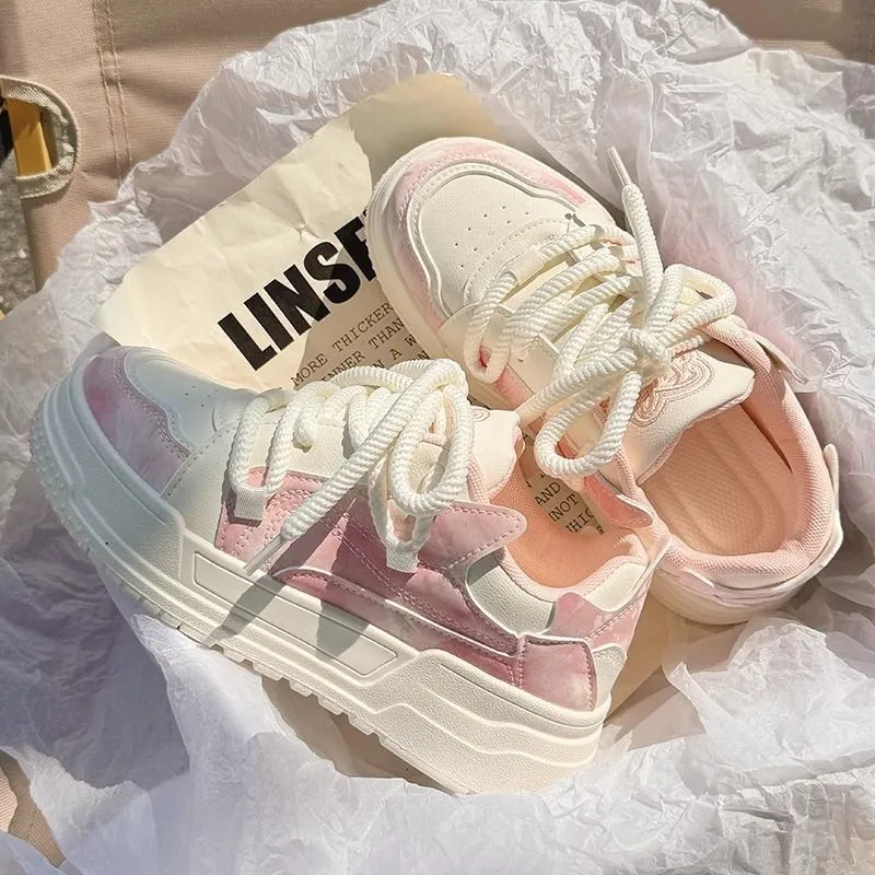Sneakers platform da donna rosa e bianche sfumate con lacci spessi dal design classico_voghion.com