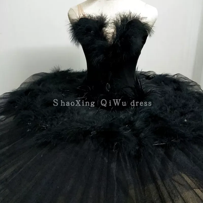 black swan ballet dress Ballerina Costume Ideas for Halloween Featuring a sleeveless design with a silver feather accent on the chest and a mesh overlay tutu skirt with white sparkles The Black Swan: Ballet's Dark